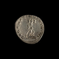 Reverse of Roman silver denarius of Trajan, showing Dacian seated right at base of trophy, legend S P Q R OPTIMO PRINCIPI.