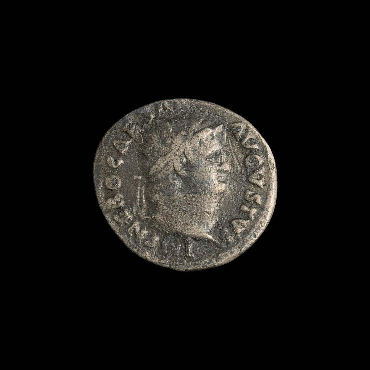 Obverse of Roman silver denarius of Nero, legend IMP NERO CAESAR AVGVSTVS, radiate or laureate bust right.