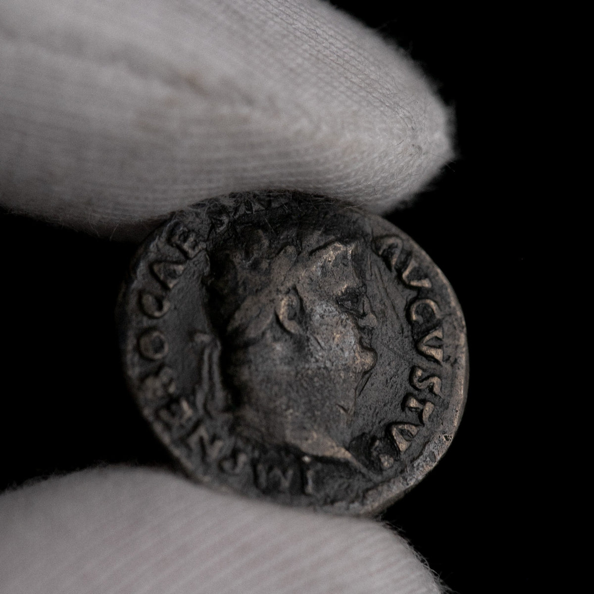 Macro detail of Roman silver denarius of Nero, portrait close-up.