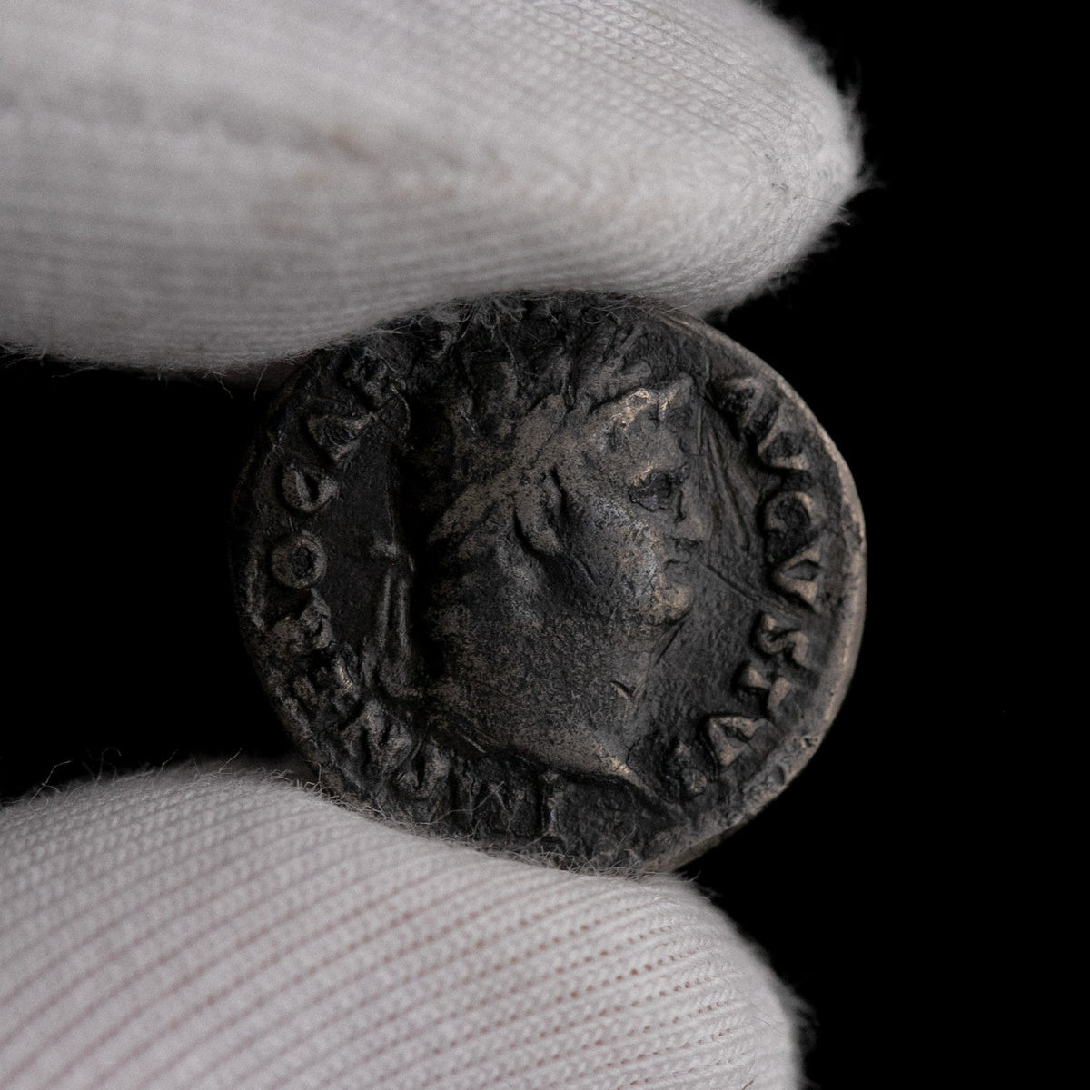 Macro detail of Roman silver denarius of Nero, portrait close-up.