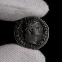 Macro detail of Roman silver denarius of Nero, portrait close-up.