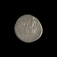 Reverse of Roman silver denarius of Vespasian, showing Vesta seated left, legend TRI-POT.