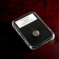 Roman silver denarius of Vespasian in protective slab with catalog label.