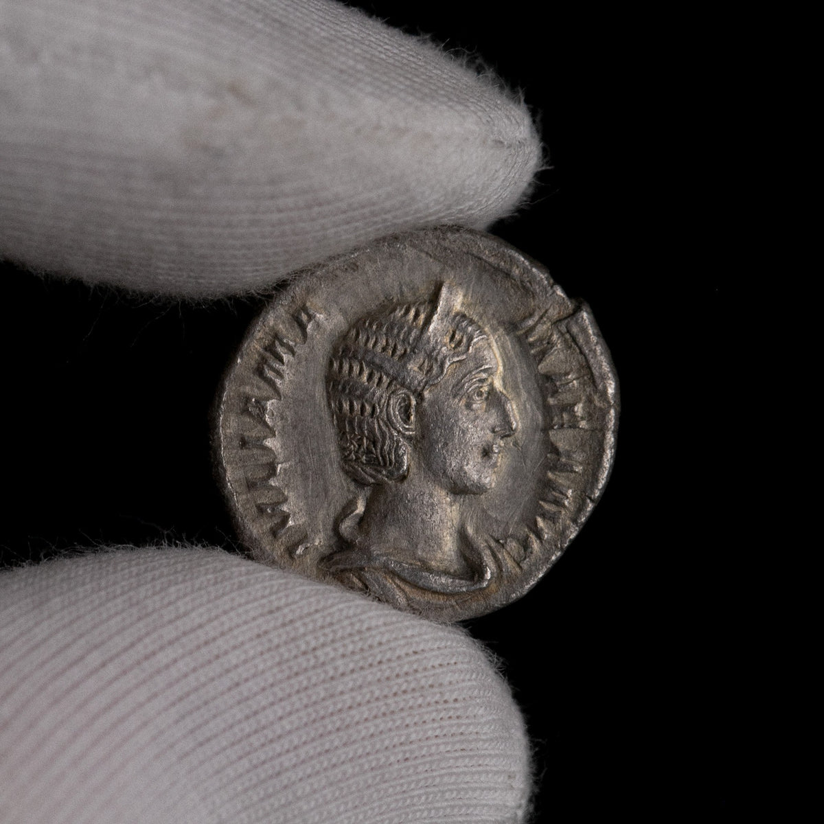 Macro detail of Roman silver denarius of Julia Mamaea, portrait close-up.