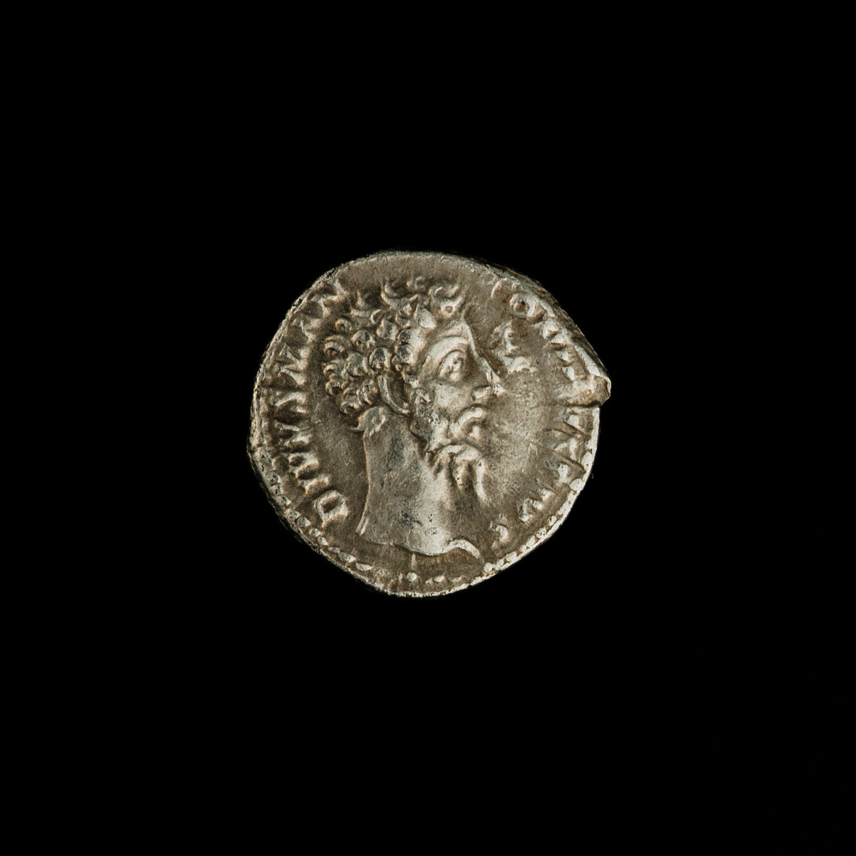 Obverse of Roman silver denarius of Divus Marcus Aurelius (under Commodus), legend DIVVS M ANTONINVS PIVS, radiate or laureate bust right.