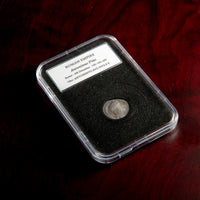 Roman silver denarius of Antoninus Pius in protective slab with catalog label.