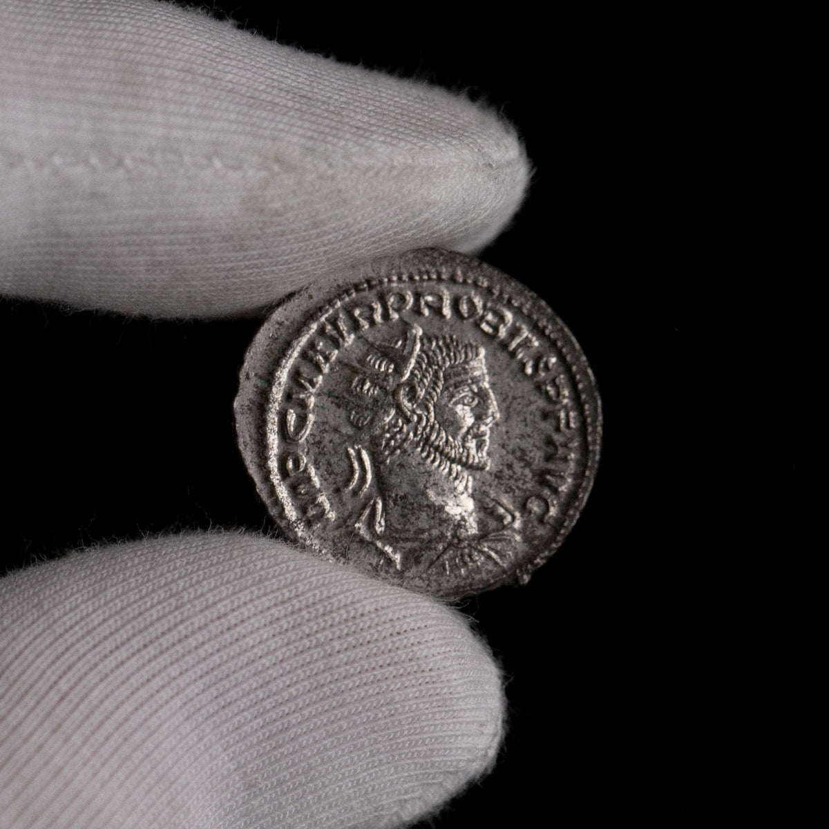 Macro detail of Roman silver antoninianus of Probus, portrait close-up.