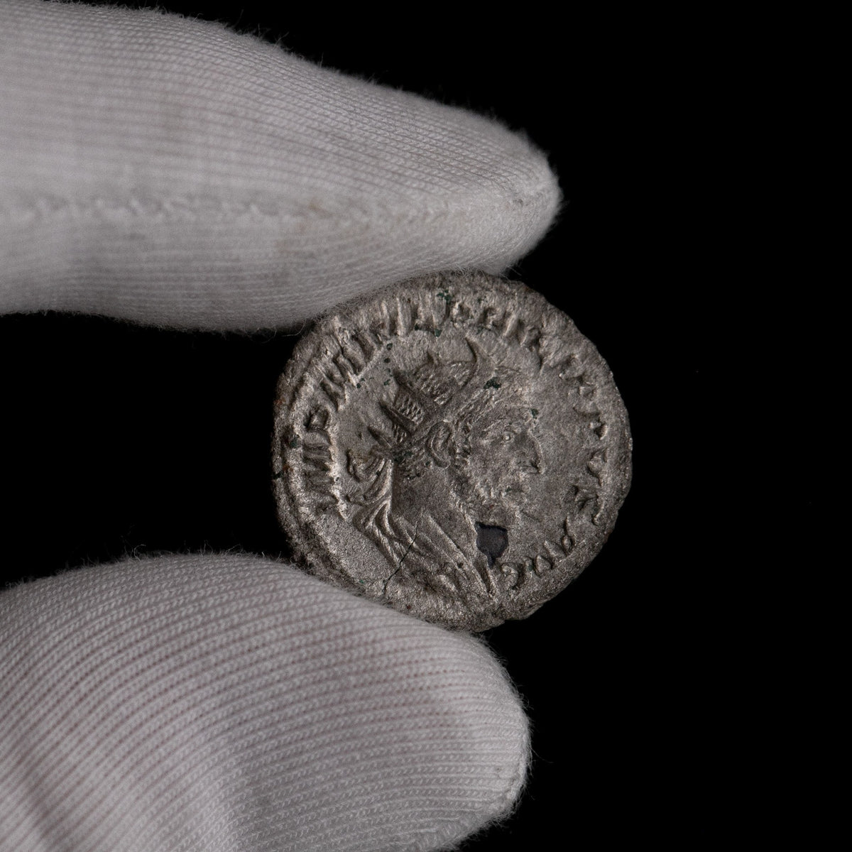 Macro detail of Roman silver antoninianus of Philip II, portrait close-up.