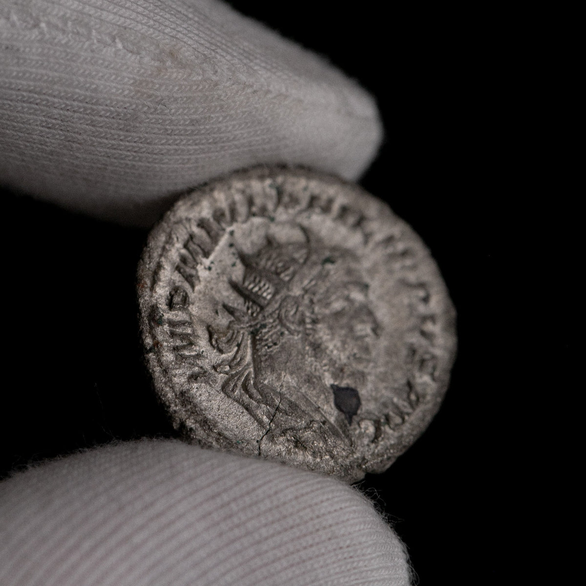 Macro detail of Roman silver antoninianus of Philip II, portrait close-up.