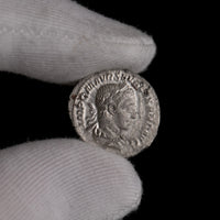 Macro detail of Roman silver denarius of Severus Alexander, portrait close-up.