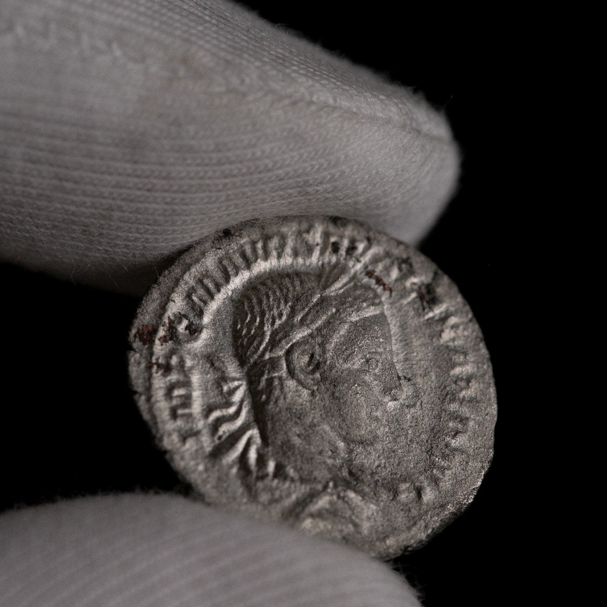 Macro detail of Roman silver denarius of Severus Alexander, portrait close-up.