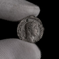 Macro detail of Roman silver denarius of Severus Alexander, portrait close-up.