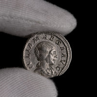 Macro detail of Roman silver denarius of Julia Maesa, portrait close-up.