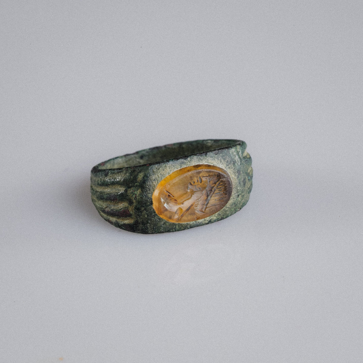 Roman Bronze Ring with Carnelian Intaglio Bust – 'Faustina' (2nd–3rd century AD)