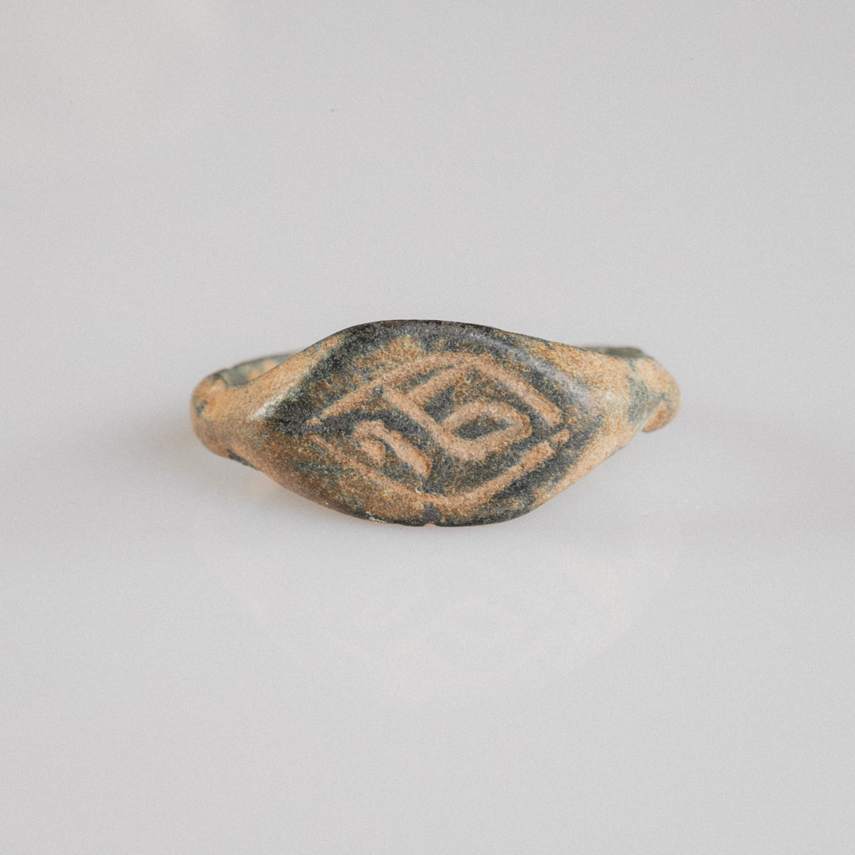 Medieval bronze signet ring Aldren, navette bezel with engraved monogram in lozenge frame, top view