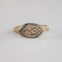 Medieval bronze signet ring Aldren, navette bezel with engraved monogram in lozenge frame, top view