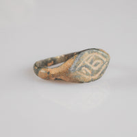 Medieval bronze ring Aldren, three-quarter view showing tapered shoulders and cuprite patina