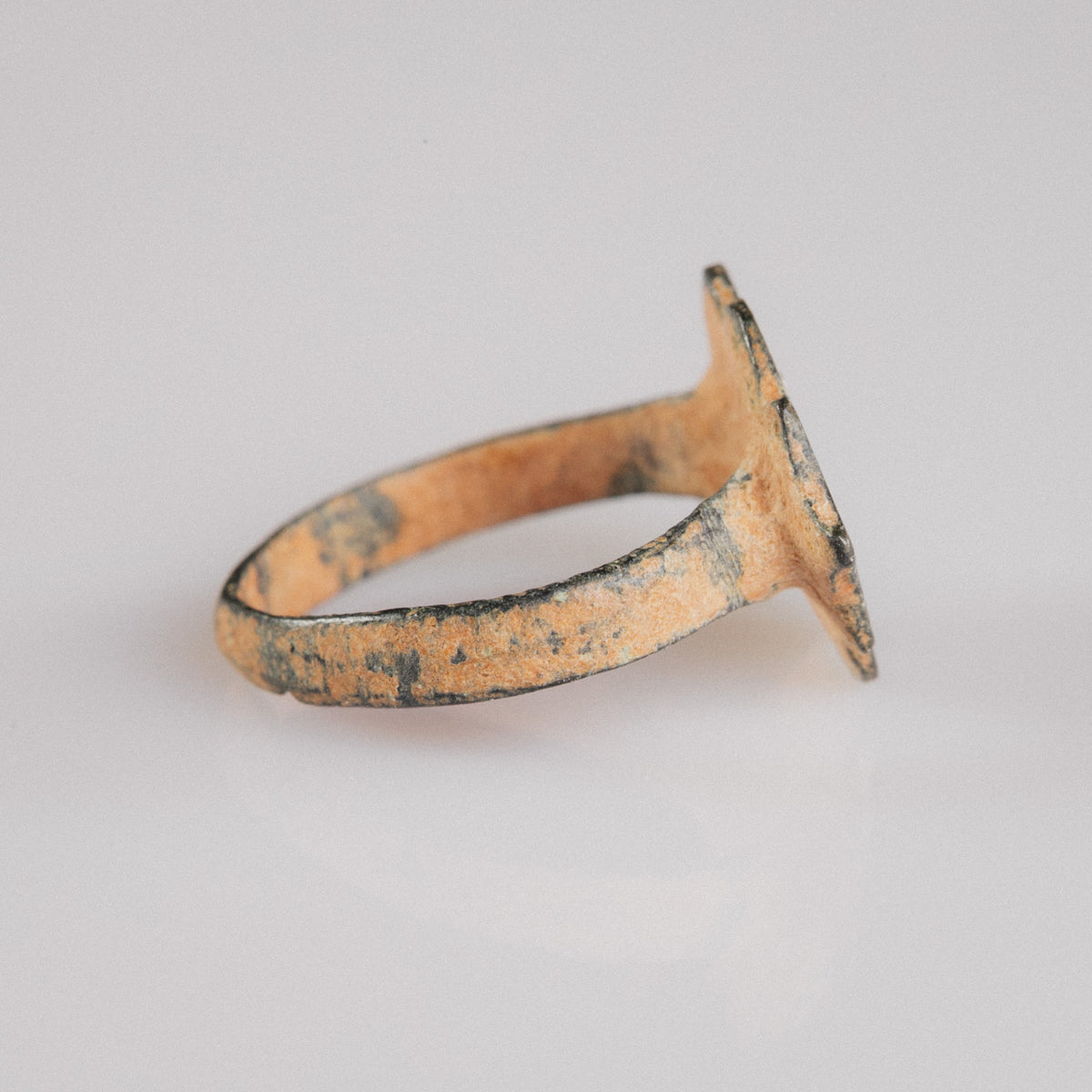 Medieval bronze ring Vladica side profile showing flat-band hoop and bezel pedestal
