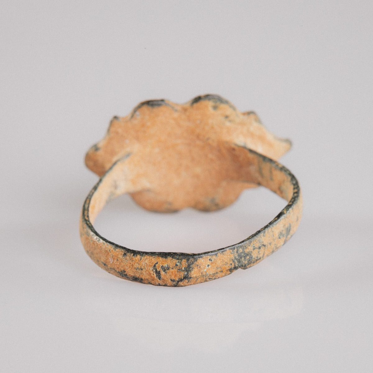 Medieval bronze ring Vladica rear view of the hoop with orange-tan earth encrustation patina