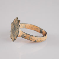 Medieval bronze ring Vladica angled view highlighting burin-incised lattice on scalloped bezel