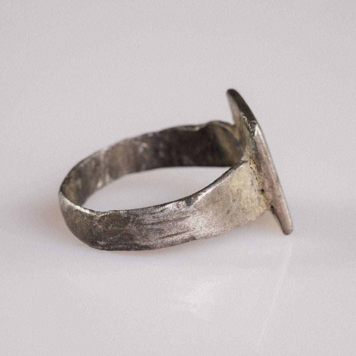 Side profile of Byzantine silver ring Theofanis revealing bezel-hoop solder junction and patina