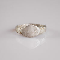 Medieval silver signet ring Aldwin with navette bezel and engraved merchant's mark, front view
