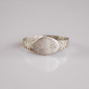 Medieval silver signet ring Aldwin with navette bezel and engraved merchant's mark, front view