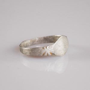 Side profile of Medieval silver ring Aldwin showing radiating star motif on shoulder