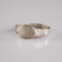 Angled view of Medieval silver signet ring Aldwin showing navette bezel and shoulder engraving