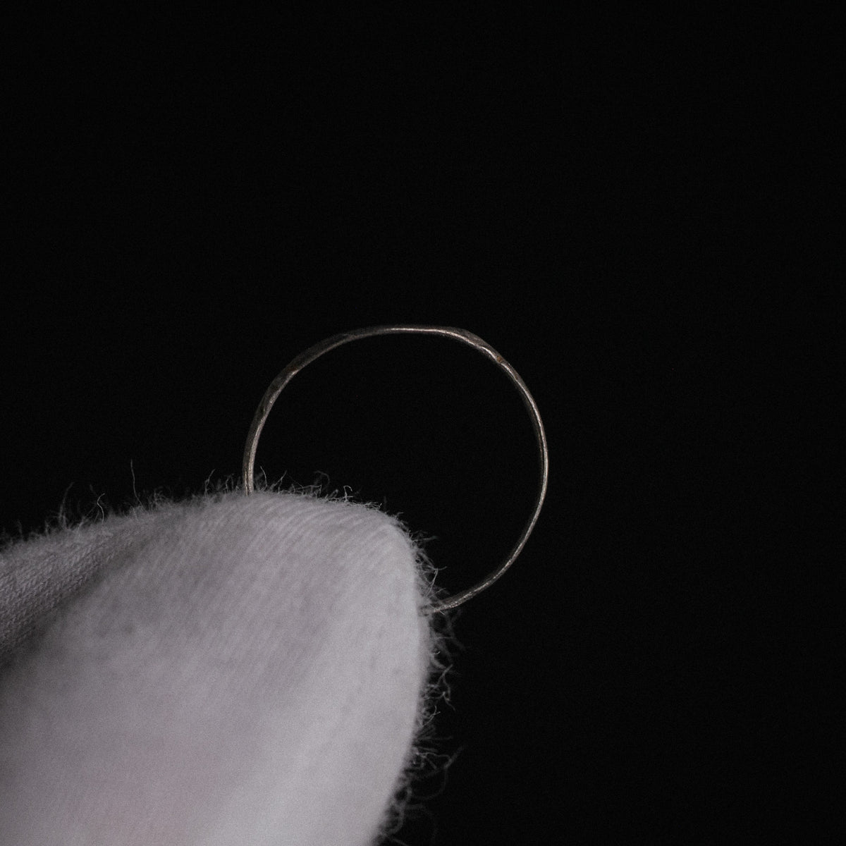 Top-down view of Medieval silver ring Aldwin showing thin sheet-metal hoop construction