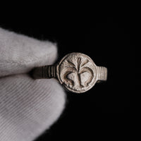 Close-up of fleur-de-lys relief motif on the bezel of the Lysenne medieval silver signet ring