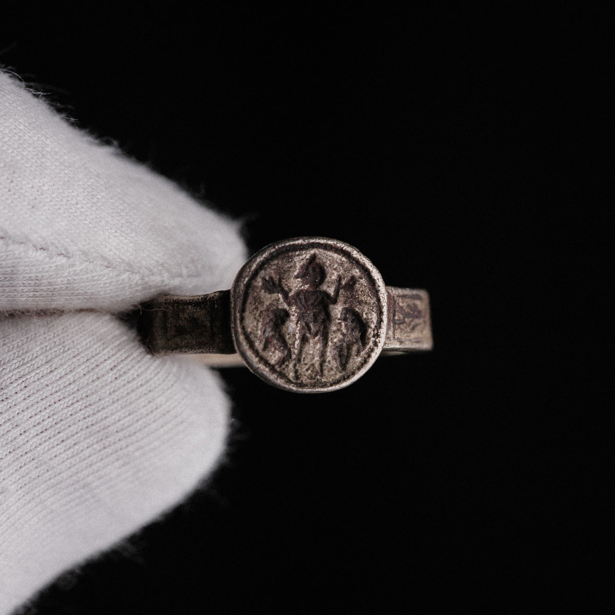 Detail of Byzantine ring Danielos showing figural bezel and compartmentalized hoop panels