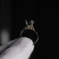 Roman bronze ring Numerius Magnus front view with flat circular bezel and integral cast shoulders