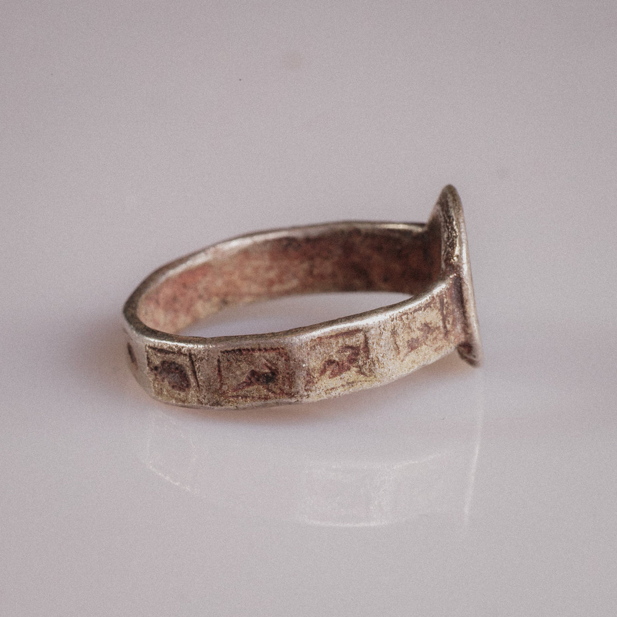 Side view of Byzantine ring Danielos with incised rectangular animal panels on band