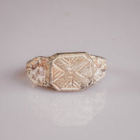 Medieval silver ring Vasilisa top view revealing geometric eight-pointed star engraving and patina