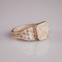 Side angle of Vasilisa silver signet ring showing applied granulation on shoulder and ribbed hoop