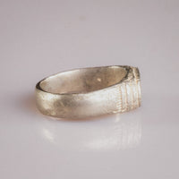 Medieval silver ring Merrick, reverse profile showing smooth interior hoop and aged silver surface
