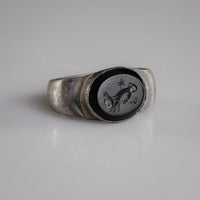 Roman silver signet ring Numerius Aquilus with eagle, star and crescent intaglio on dark stone