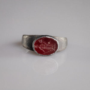 Roman silver signet ring Sereia with red garnet Isis-Fortuna intaglio, top view of bezel