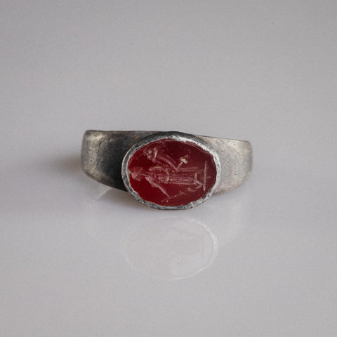 Roman silver signet ring Sereia with red garnet Isis-Fortuna intaglio, top view of bezel