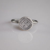 Byzantine silver ring Crucia with cross pattée in lozenge frame on disc bezel