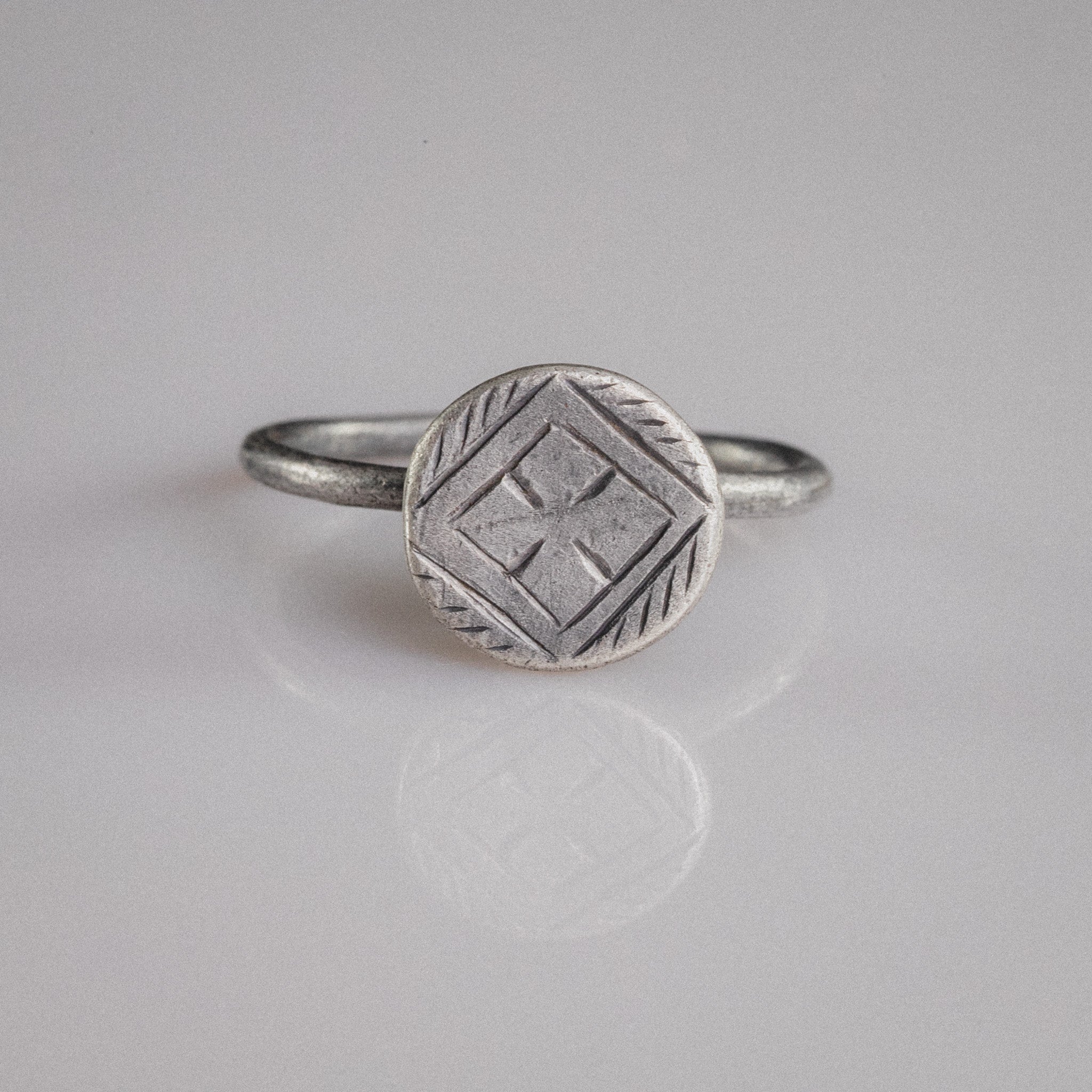 Byzantine silver ring Crucia with cross pattée in lozenge frame on disc bezel