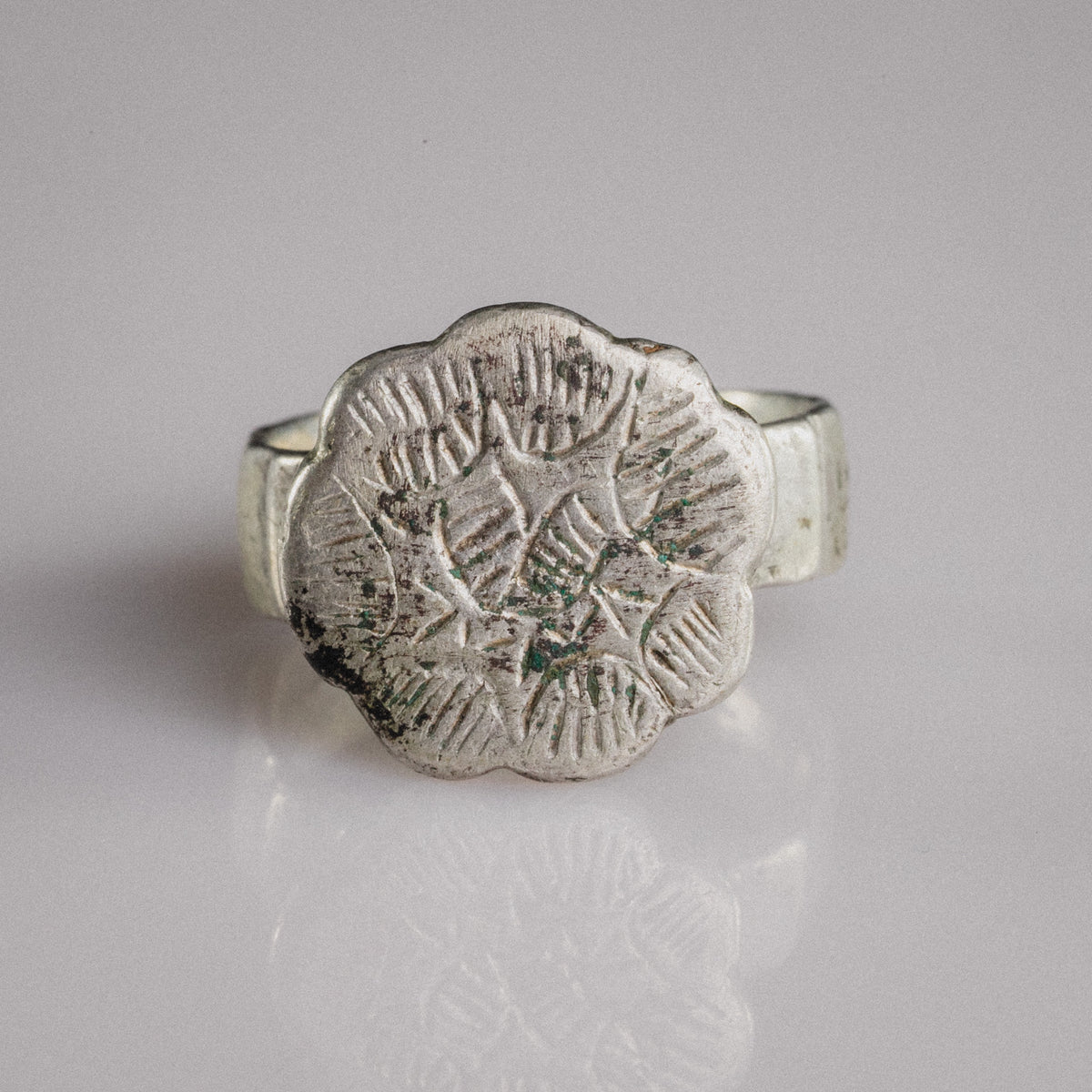 Medieval silver signet ring Florian with sexfoil bezel and engraved star rosette motif