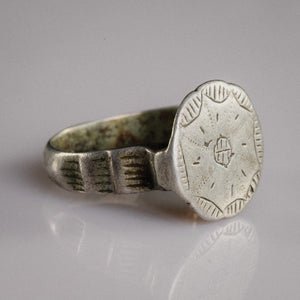 Side view of medieval silver ring Stavros showing hatched rectangular shoulder panels and D-section hoop