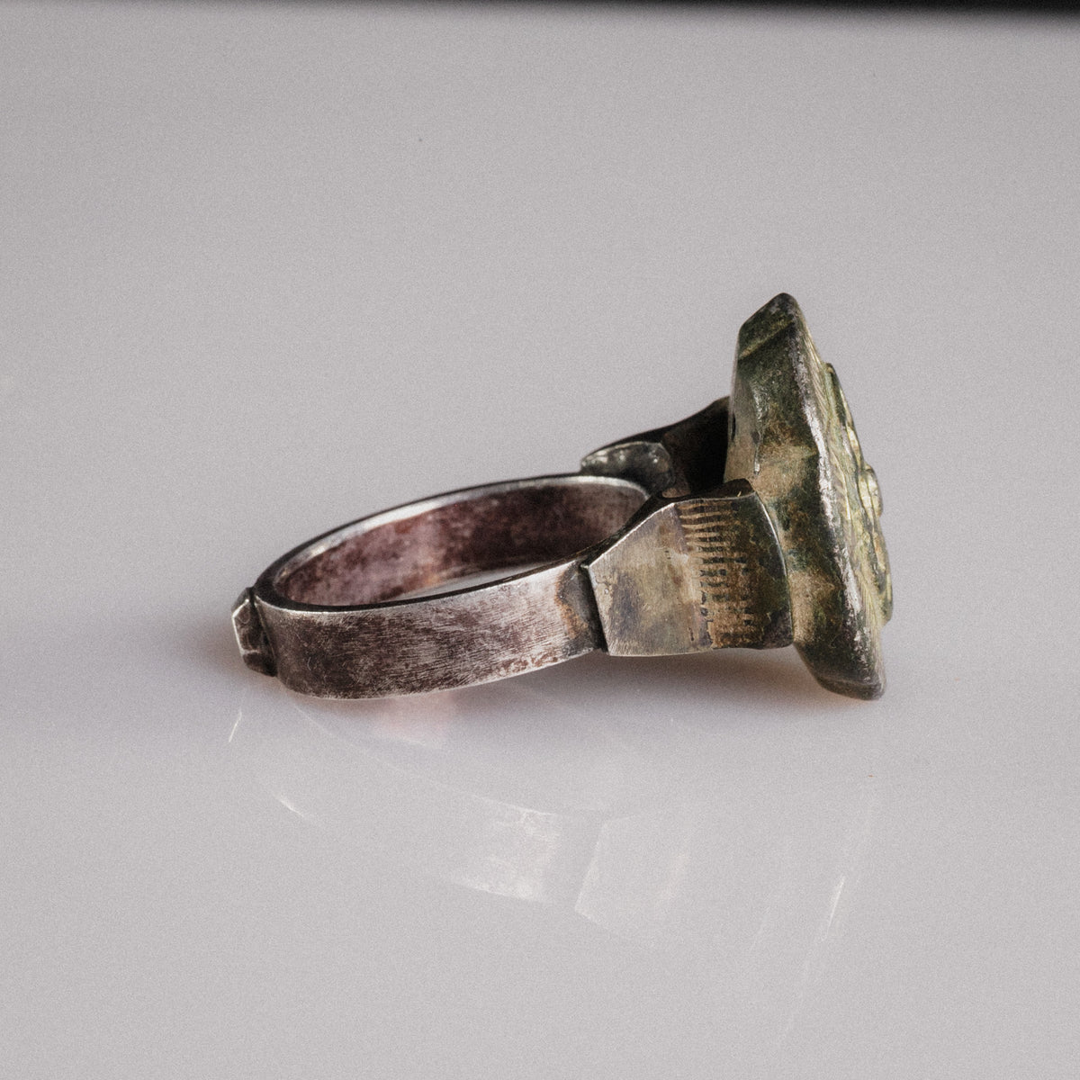 Side profile of Islamic silver ring Gulizar revealing flat-band hoop and bezel construction