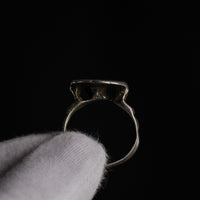 Underside silhouette of medieval silver ring Stavros revealing concave bezel and slim hoop