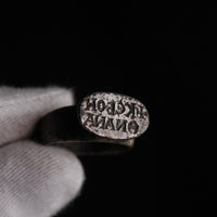 Byzantine silver ring Anna macro detail of retrograde Greek inscription on oval bezel