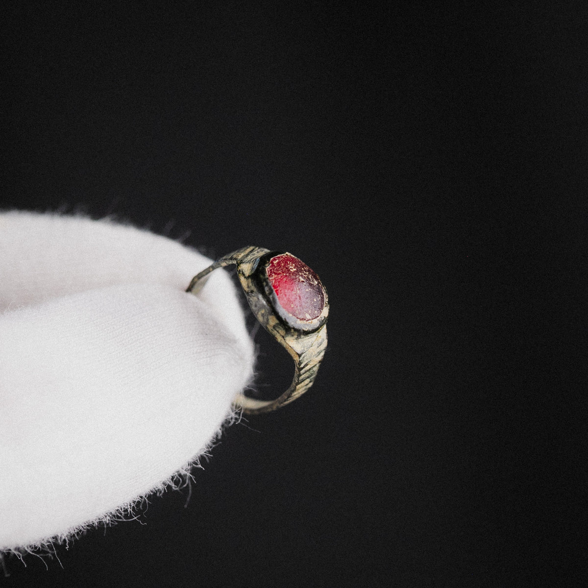 Medieval Bronze Ring with Red Glass Cabochon – 'Carminis' (9th–14th CE)