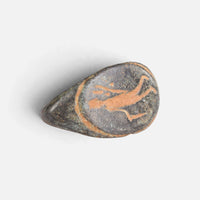 Roman bronze ring 'Mercurialis' shows its oval figural engraving and broad shoulder at an angle.