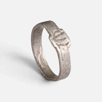 Roman silver ring 'Sextus' shows its small incised bezel and flat band at an angle.